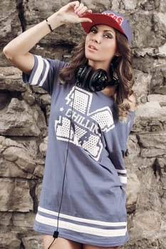 Outdoor, street. Attractive girl in the cap