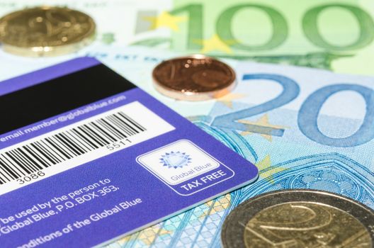 MUNICH, GERMANY - FEBRUARY 24, 2014: Closeup logotype Global Blue on the backside of plastic card against Euro cash