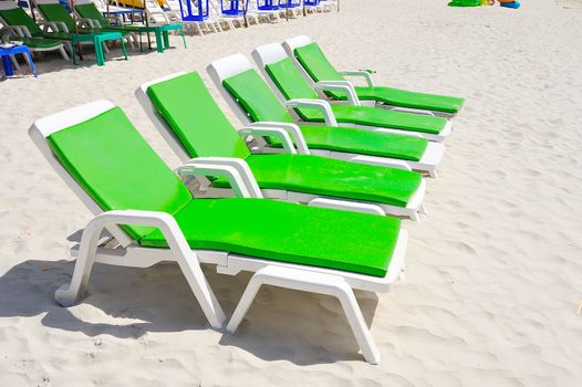 deck chairs on the beach at koh lan ,pattaya, thailand