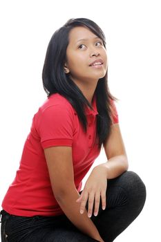 Asian girl wearing red shirt looking up