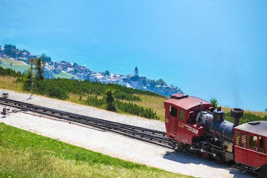 ST. WOLFGANG, AUSTRIA - AUGUST 6: Steam train railway going to Schafberg Peak (1783m) on August 6, 2013 in St. Wolfgang.