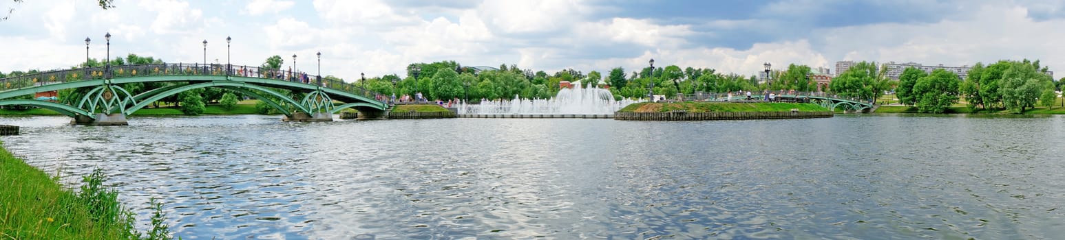 Summer Panorama: bridge over the river and fountain