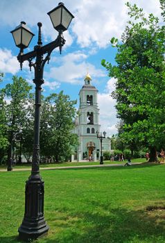 Old lantern on the background of the Christian orthodox church of the 18th century