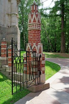 Wicket of red brick decorated with white pattern                               
