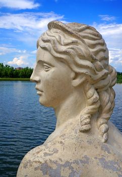  Female antique profile  marble background on a pond                              
