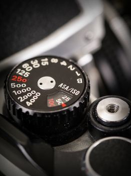 Macro photo of the shutter knob and shutter release of an old 35mm film camera.
