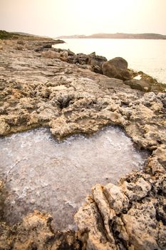 Salty water trapped in Rocks in Bugibba, Malta, Europe.