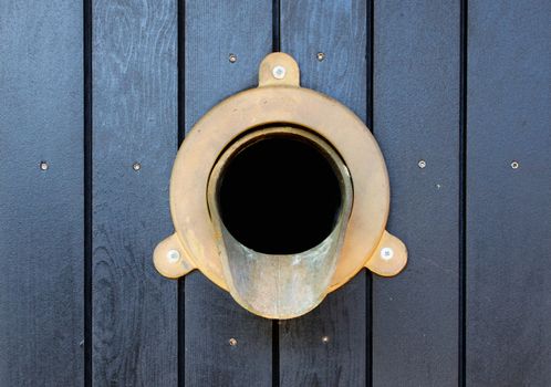 Wall Brass Gutter downspout that is part of a water drainage system