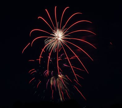 fireworks lighting the night sky in different colors