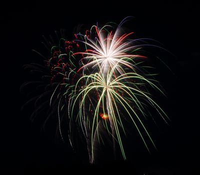 fireworks lighting the night sky in different colors