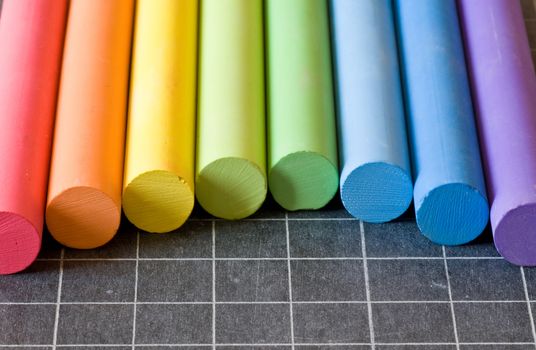 school supplies - chalks on chalkbord closeup