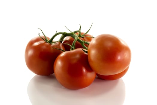 bunch of red tomatoes isolated on white