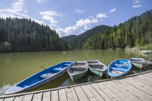 Boat docks on a beautiful lake in forest (Red Lake in Romania)