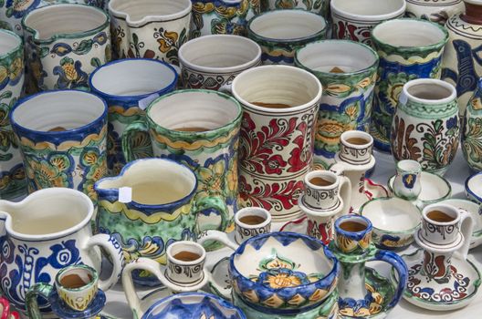 Romanian traditional pottery handcrafted mugs at a souvenir shop