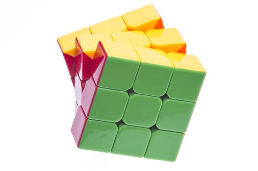 Cloase up image of a Rubik's cube on white.