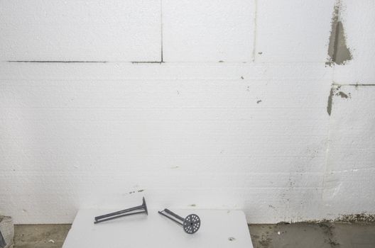 Styrofoam wall insulation project : expansion anchor and styrofoam sheet