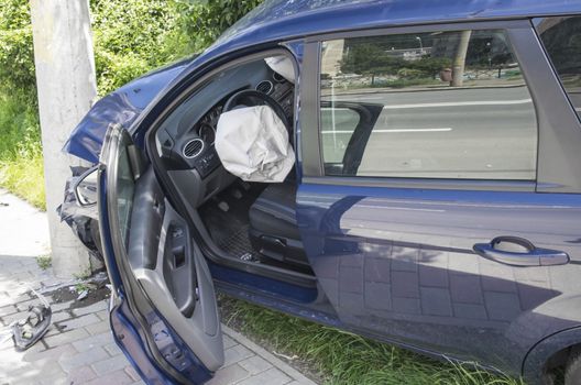 Wrecked car with opened airbags after accident
