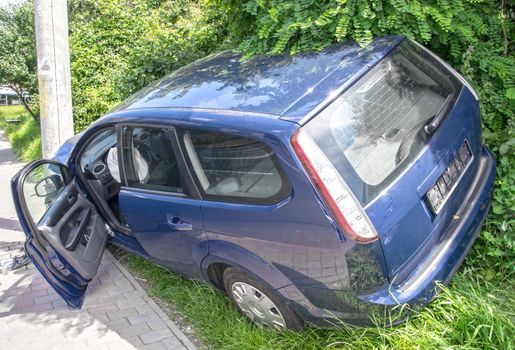 Wrecked car in the city, frontal damage