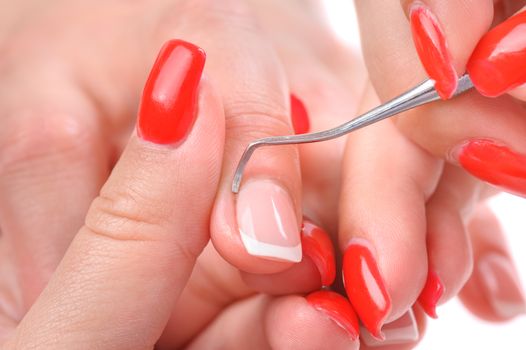 beauty salon, manicure applying, cleaning the cuticles