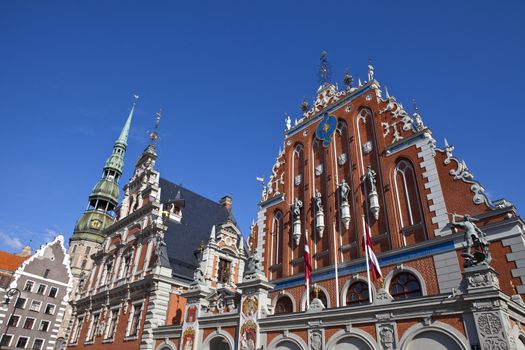 The historic House of the Blackheads and St. Peter's Church in the old town of Riga in Latvia.