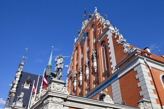 The historic House of the Blackheads with the steeple of St. Peter's Church in the background, in the old town of Riga in Latvia.