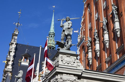 The historic House of the Blackheads with the steeple of St. Peter's Church in the background, in the old town of Riga in Latvia.