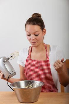 young woman baking a cake