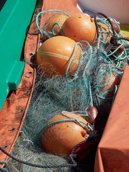 Details of colorful fishing nets on a boat