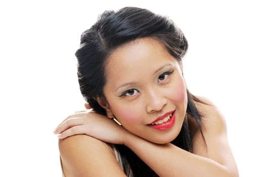Asian teenager looking happy wearing makeup