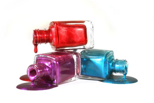 Salon Concept of Stacked Fingernail Polish of Red Blue and Purple