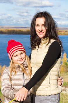 Photo of mother and daughter in autumn