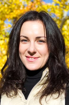 Photo of beautiful young brunette in autumn