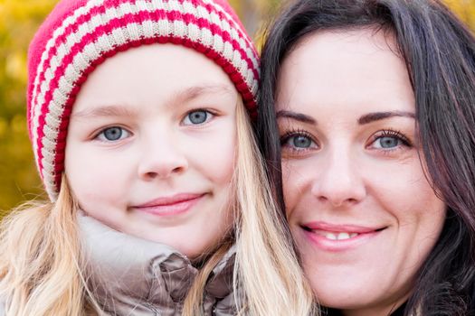 Photo of mother and daughter in autumn