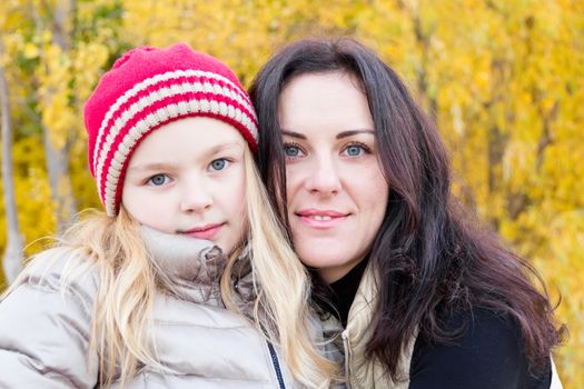 Photo of mother and daughter in autumn