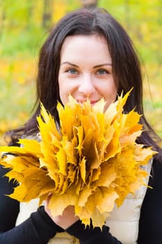 Photo of beautiful young brunette in autumn