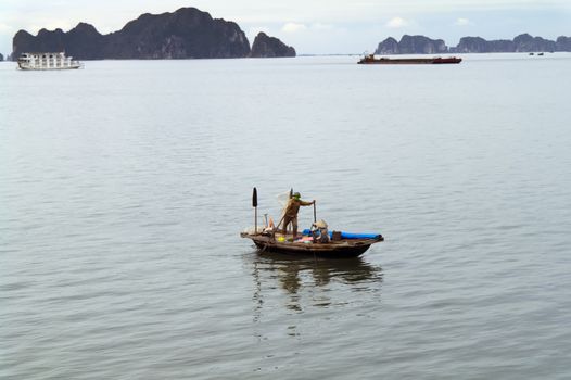 Fishermen Family on the Boat in Ha Long Bay, Vietnam. View from Ship.