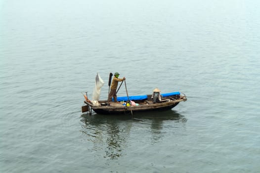 Fishing Boat in Ha Long Bay, Vietnam. View from Ship.