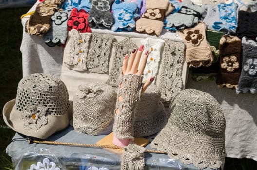 female linen hats and wristlets crocheted at market trade
