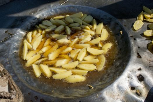 French fries in the pan at african market
