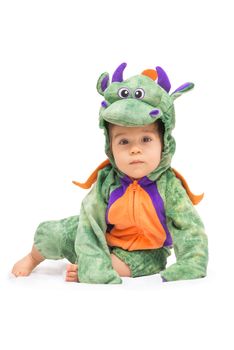 Purple, orange and green dragon costume on baby isolated on pure white