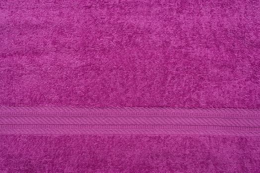 Terry lilac colored cloth towel texture as a background