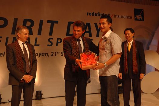 jakarta, indonesia-september 21, 2010: AXA CEO-Henri de Castries receiving gift from AXA indonesia in AXA spirit day at mulia hotel senayan, jakarta-indonesia.