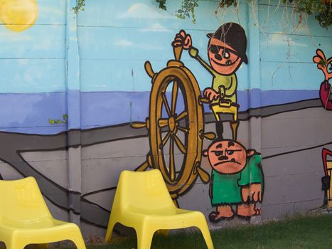 Funny colorful creative graffiti on a wall  