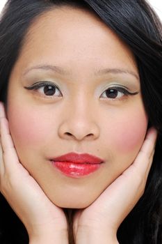 Asian womans face closeup showing natural beauty
