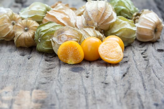 Cape gooseberry, physalis on wood background.