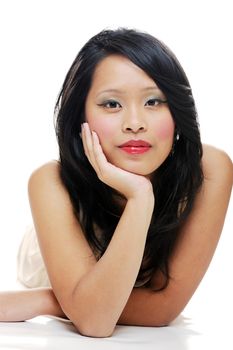 Asian female looking thoughtful wearing makeup