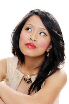 Asian lady with makeup looking up with serious expression