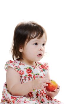 Young infant girl holding apple portrait