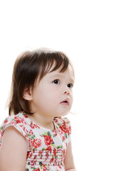 Perplexed young infant girl looking up