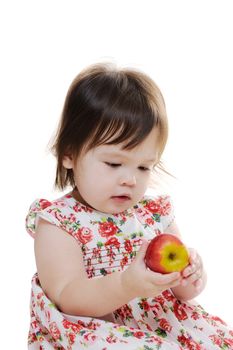 Young infant girl holding an apple